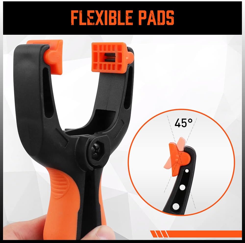 Heavy duty 5-inch orange and black spring clamps with flexible jaw pads and ergonomic handles for woodworking, DIY, and backdrop support