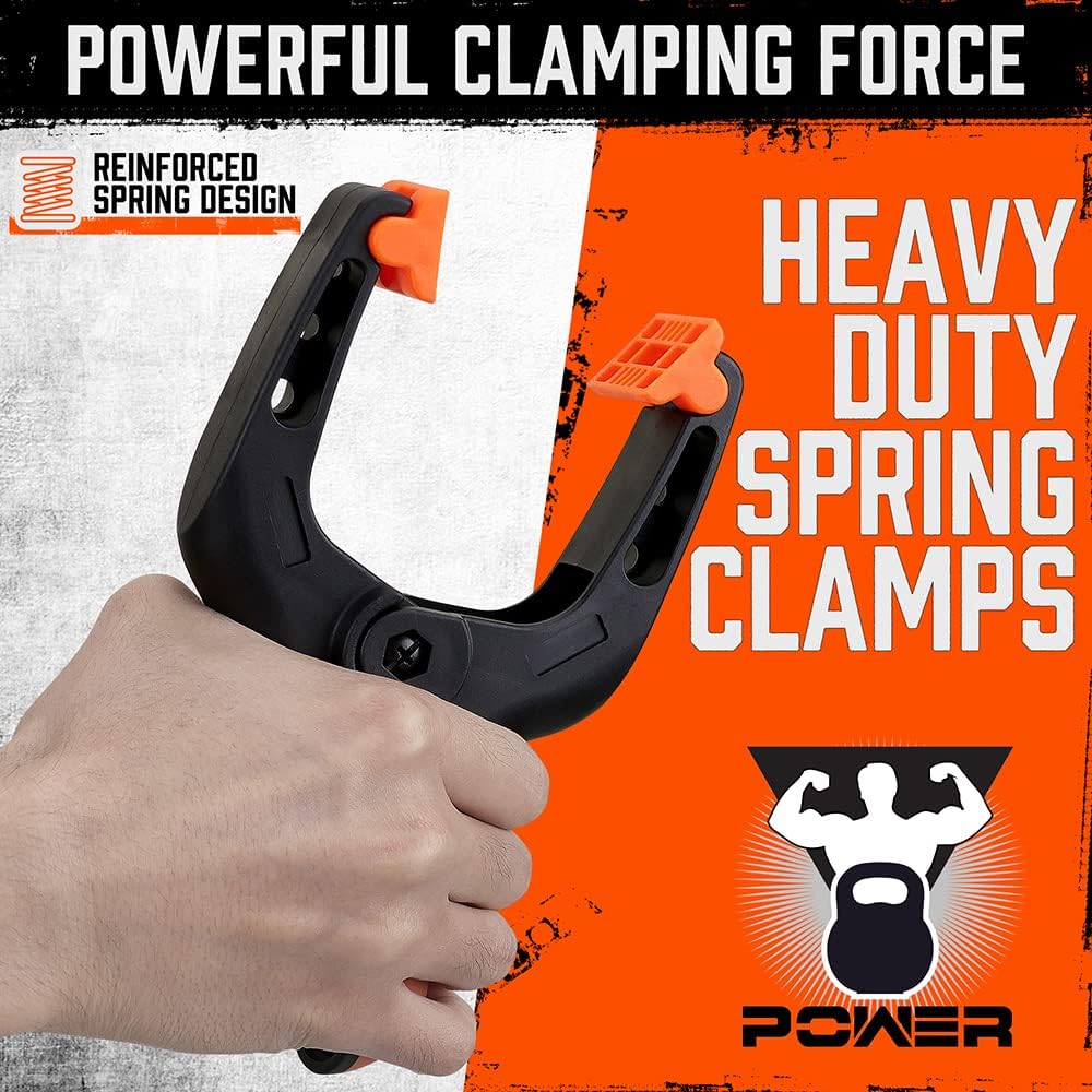 Heavy duty 7-inch spring clamps with orange and black ergonomic handle and flexible jaw pads for woodworking and photography