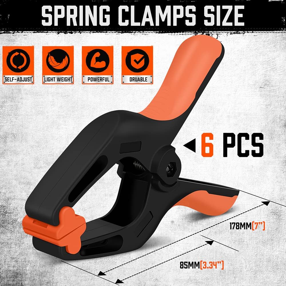 Heavy duty 7-inch spring clamps with orange and black ergonomic handle and flexible jaw pads for woodworking and photography