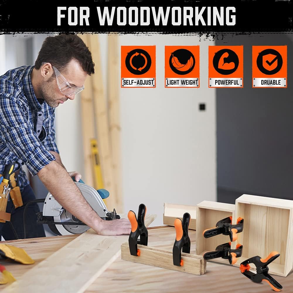 Heavy duty 7-inch spring clamps with orange and black ergonomic handle and flexible jaw pads for woodworking and photography