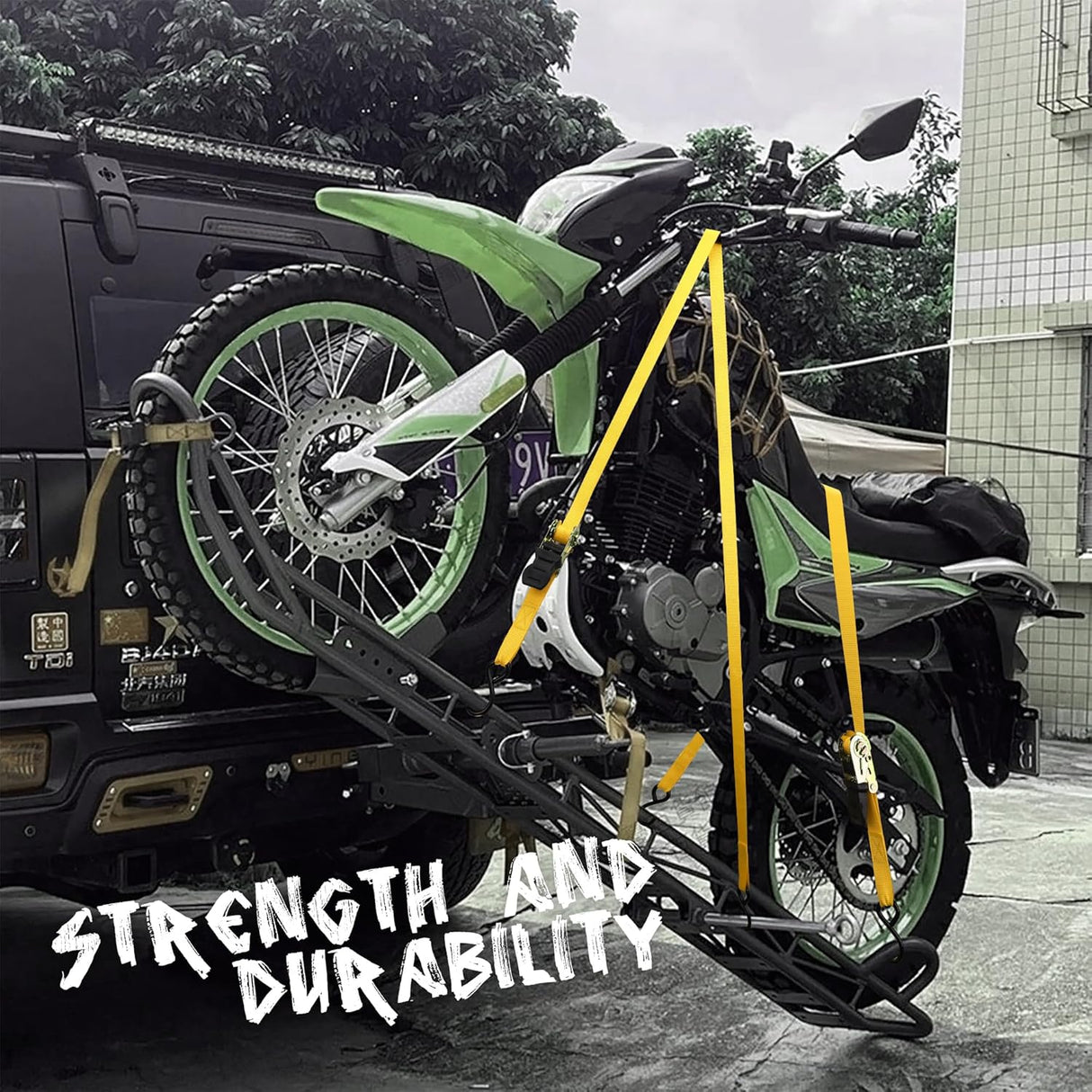 Heavy-duty ratchet tie down strap set with ergonomic handles, coated S-hooks, and bungee cords for secure cargo transport