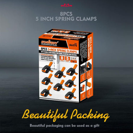 Heavy duty 5-inch orange and black spring clamps with flexible jaw pads and ergonomic handles for woodworking, DIY, and backdrop support